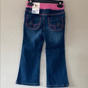 jeans with pink belt